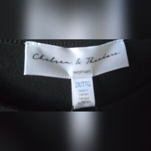 Chelsea & Theodore Black Top with Floral Sleeves.